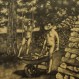 Two Naturist Men, on doing Yard Work, the other on a Swing by Friese Undine